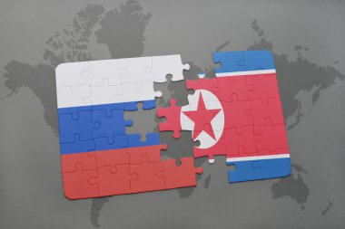 bir dünya haritası arka plan üzerinde Rusya ve Kuzey Kore ulusal bayrağı ile bulmaca.