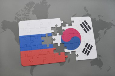 bir dünya haritası arka plan üzerinde Rusya ve Güney Kore ulusal bayrağı ile bulmaca.