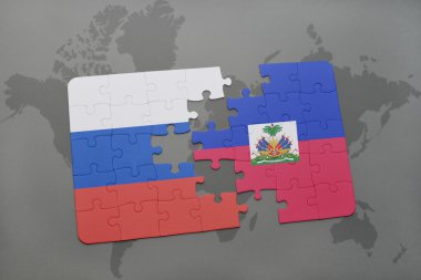 bir dünya haritası arka plan üzerinde Rusya ve Haiti ulusal bayrağı ile bulmaca.