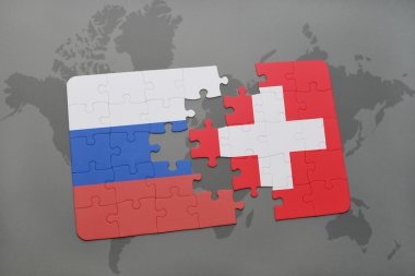 bir dünya haritası arka plan üzerinde Rusya ve İsviçre ulusal bayrağı ile bulmaca.
