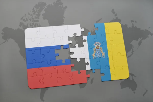 Головоломка з національним прапором Росії та Канарських островів на карті світу. — стокове фото