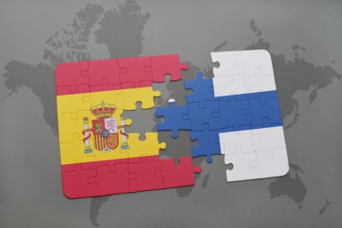 bir dünya haritası arka plan üzerinde İspanya ve Finlandiya ulusal bayrağı ile bulmaca.