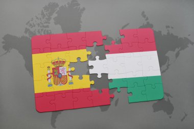 bir dünya haritası arka plan üzerinde İspanya ve Macaristan ulusal bayrağı ile bulmaca.