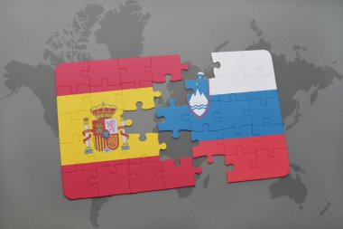 bir dünya haritası arka plan üzerinde İspanya ve Slovenya ulusal bayrağı ile bulmaca.