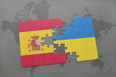 bir dünya haritası arka plan üzerinde İspanya ve Ukrayna ulusal bayrağı ile bulmaca.