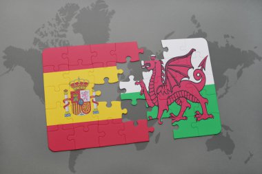 bir dünya haritası arka plan üzerinde İspanya ve Galler ulusal bayrağı ile bulmaca.
