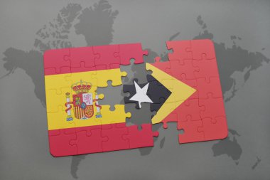 bir dünya haritası arka plan üzerinde İspanya ve doğu timor ulusal bayrağı ile bulmaca.