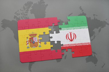 bir dünya haritası arka plan üzerinde İspanya ve İran ulusal bayrağı ile bulmaca.