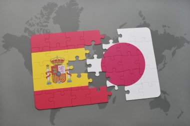 bir dünya haritası arka plan üzerinde İspanya ve Japonya ulusal bayrağı ile bulmaca.