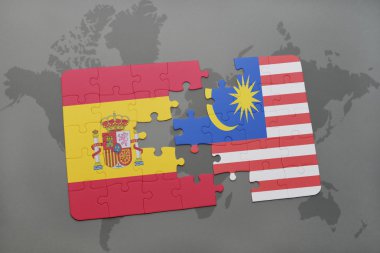 bir dünya haritası arka plan üzerinde İspanya ve Malezya ulusal bayrağı ile bulmaca.