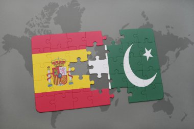 bir dünya haritası arka plan üzerinde İspanya ve Pakistan ulusal bayrağı ile bulmaca.