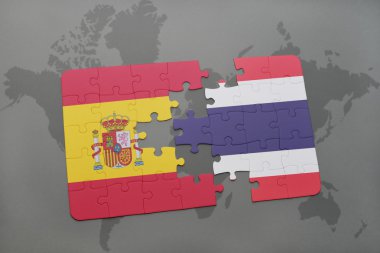 bir dünya haritası arka plan üzerinde İspanya ve Tayland ulusal bayrağı ile bulmaca.