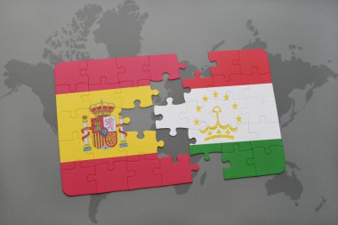 bir dünya haritası arka plan üzerinde İspanya ve Tacikistan ulusal bayrağı ile bulmaca.