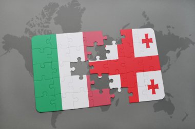 bir dünya haritası arka plan üzerinde İtalya ve Gürcistan ulusal bayrağı ile bulmaca.