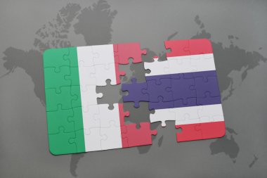 puzzle with the national flag of italy and thailand on a world map background.