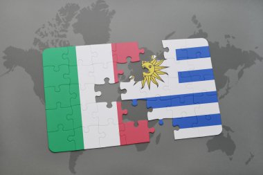puzzle with the national flag of italy and uruguay on a world map background.