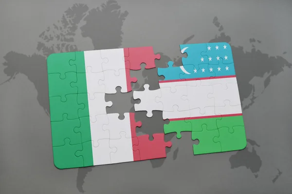 Puzzle with the national flag of italy and uzbekistan on a world map background. — Stok fotoğraf