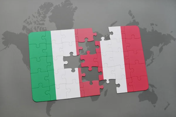 Puzzle with the national flag of italy and peru on a world map background. — 스톡 사진