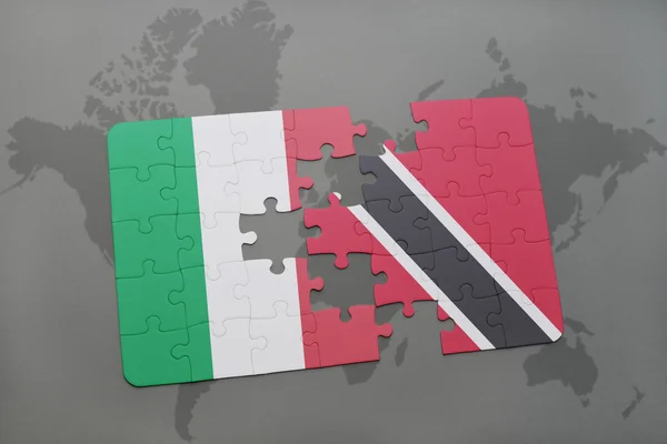 Puzzle with the national flag of italy and trinidad and tobago on a world map background. — Stok fotoğraf