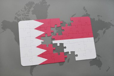 bir dünya haritası arka plan üzerinde bahreyn ve endonezya ulusal bayrağı ile bulmaca.