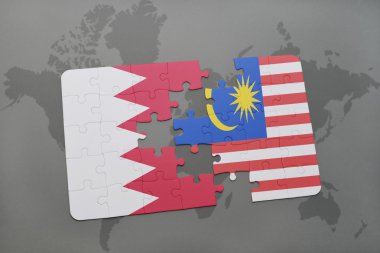 bir dünya haritası arka plan üzerinde bahreyn ve malezya ulusal bayrağı ile bulmaca.
