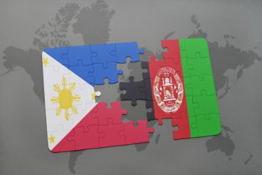 bir dünya haritası arka plan üzerinde Filipinler ve Afganistan ulusal bayrağı ile bulmaca.