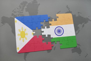 bir dünya haritası arka plan üzerinde Filipinler ve Hindistan ulusal bayrağı ile bulmaca.