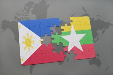 bir dünya haritası arka plan üzerinde Filipinler ve Myanmar ulusal bayrağı ile bulmaca.