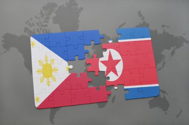 bir dünya haritası arka plan üzerinde Filipinler ve Kuzey Kore ulusal bayrağı ile bulmaca.