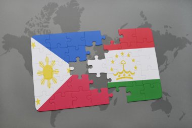 bir dünya haritası arka plan üzerinde Filipinler ve Tacikistan ulusal bayrağı ile bulmaca.