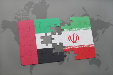 puzzle with the national flag of united arab emirates and iran on a world map background.