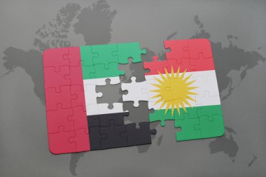 puzzle with the national flag of united arab emirates and kurdistan on a world map background.