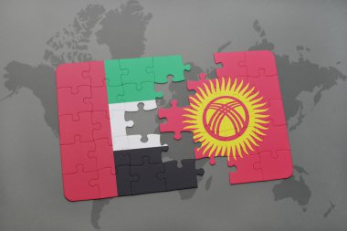 puzzle with the national flag of united arab emirates and kyrgyzstan on a world map background.