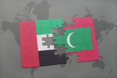 bir dünya haritası arka plan üzerinde birleşik arap emirlikleri ve Maldivler ulusal bayrağı ile bulmaca.