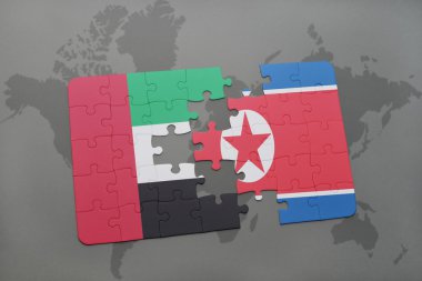 bir dünya haritası arka plan üzerinde birleşik arap emirlikleri ve kuzey kore ulusal bayrağı ile bulmaca.