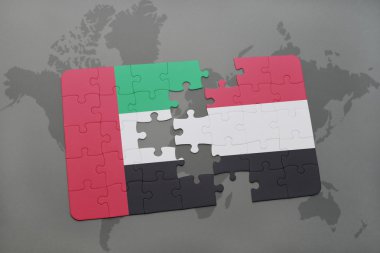 bir dünya haritası arka plan üzerinde birleşik arap emirlikleri ve yemen ulusal bayrağı ile bulmaca.