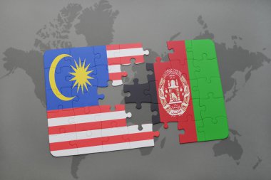 bir dünya haritası arka plan üzerinde Malezya ve Afganistan ulusal bayrağı ile bulmaca.