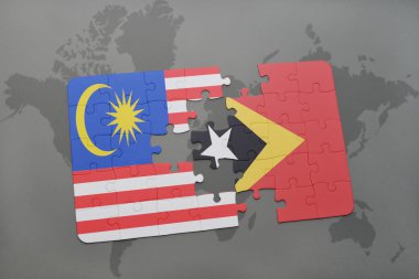 bir dünya haritası arka plan üzerinde malezya ve doğu timor ulusal bayrağı ile bulmaca.