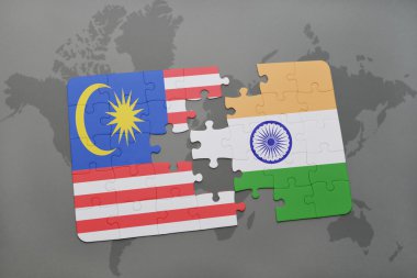 bir dünya haritası arka plan üzerinde malezya ve hindistan ulusal bayrağı ile bulmaca.