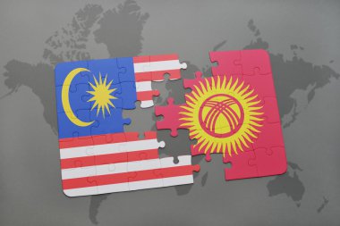bir dünya haritası arka plan üzerinde malezya ve Kırgızistan ulusal bayrağı ile bulmaca.