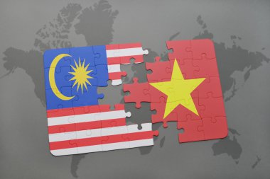 bir dünya haritası arka plan üzerinde Malezya ve Vietnam ulusal bayrağı ile bulmaca.