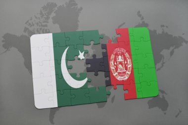 bir dünya haritası arka plan üzerinde pakistan ve afganistan ulusal bayrağı ile bulmaca.