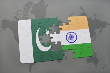 bir dünya haritası arka plan üzerinde pakistan ve Hindistan ulusal bayrağı ile bulmaca.