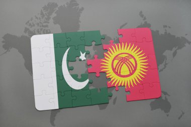 bir dünya haritası arka plan üzerinde pakistan ve Kırgızistan ulusal bayrağı ile bulmaca.