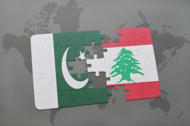 bir dünya haritası arka plan üzerinde pakistan ve lübnan ulusal bayrağı ile bulmaca.