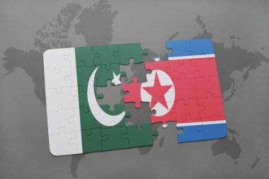 bir dünya haritası arka plan üzerinde pakistan ve kuzey kore ulusal bayrağı ile bulmaca.