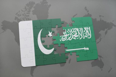 bir dünya haritası arka plan üzerinde Pakistan ve Suudi Arabistan ulusal bayrağı ile bulmaca.