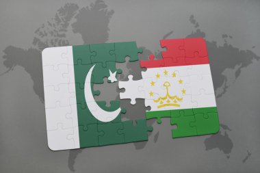 bir dünya haritası arka plan üzerinde pakistan ve tacikistan ulusal bayrağı ile bulmaca.
