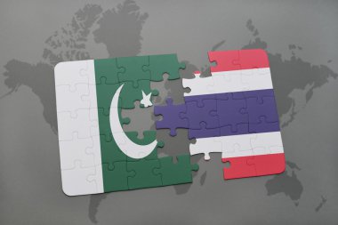 bir dünya haritası arka plan üzerinde pakistan ve tayland ulusal bayrağı ile bulmaca.
