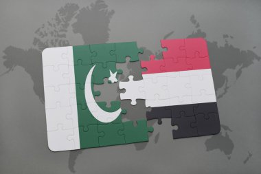 bir dünya haritası arka plan üzerinde pakistan ve yemen ulusal bayrağı ile bulmaca.